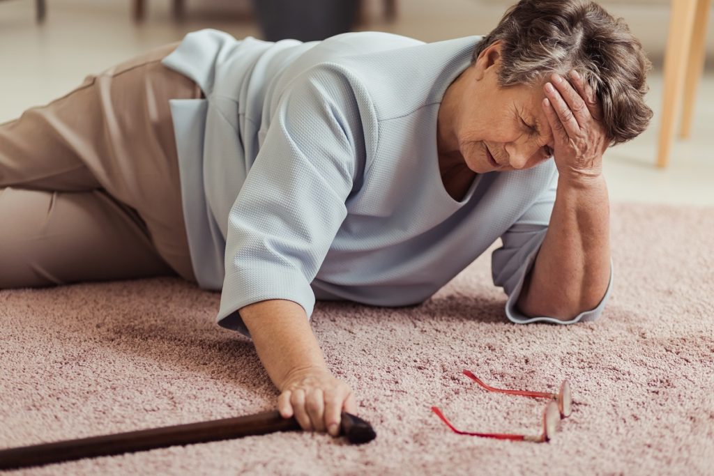 Elderly woman lying on the floor