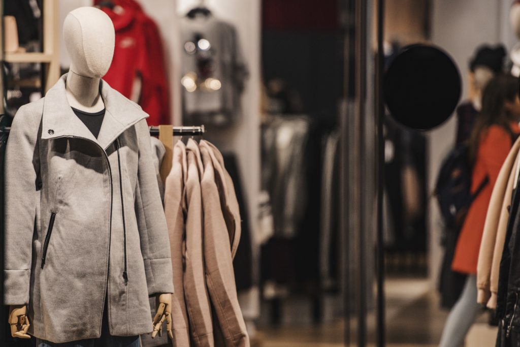 mannequins in store wearing clothing materials
