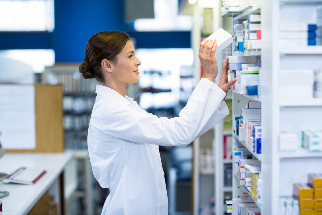 a pharmacist arranging medicine 