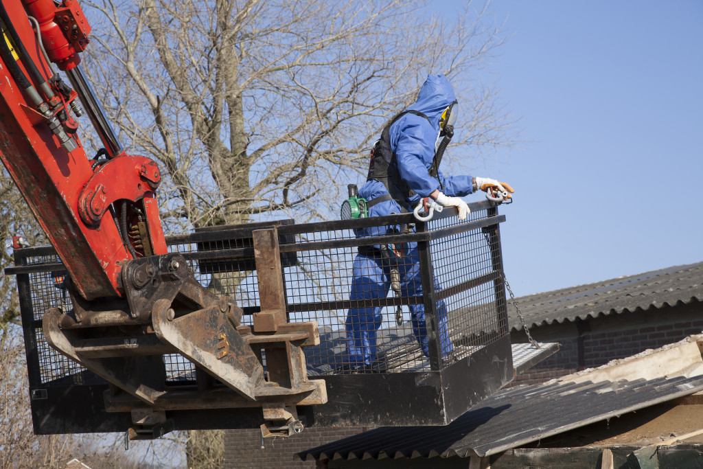 Worker removing asbestos