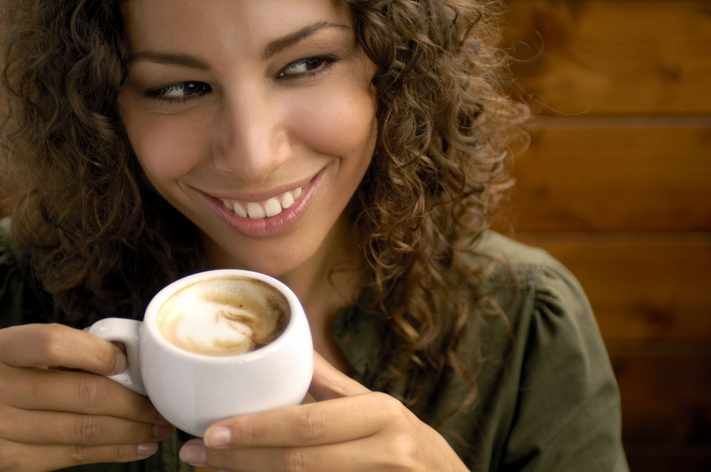 Woman drinking coffee in a mug
