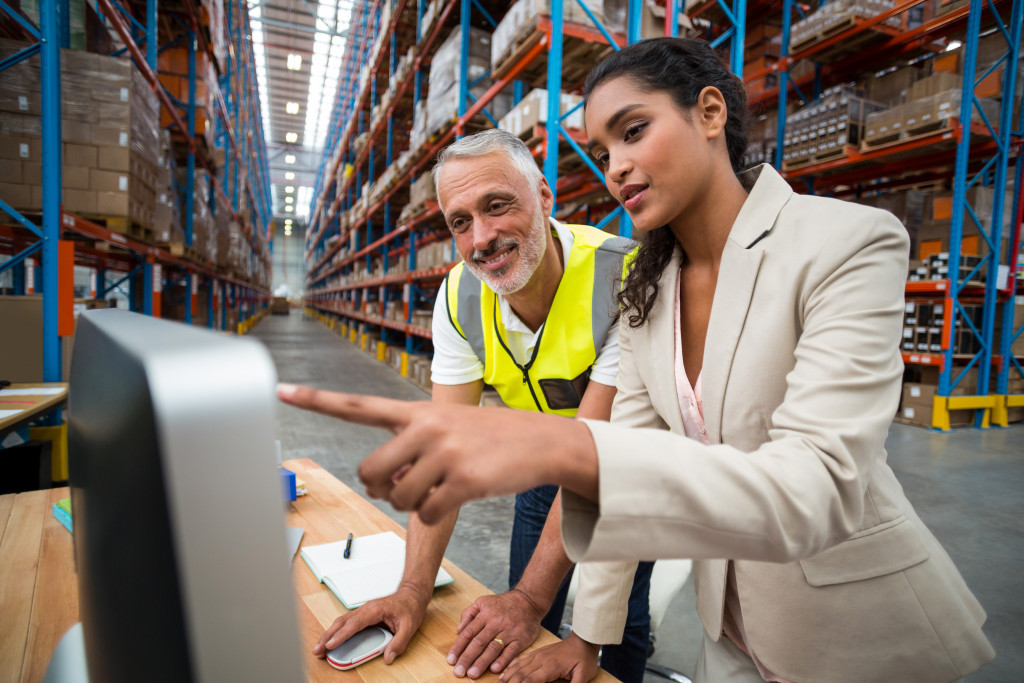 Warehouse managers managing inventory