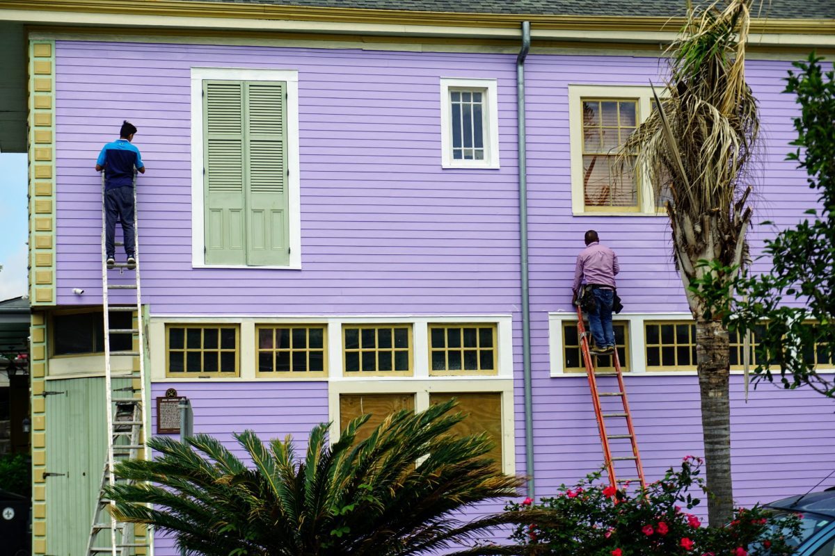 2 men painting house