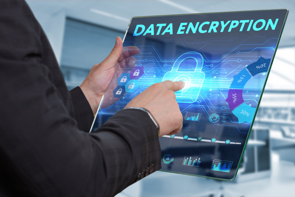 a businessman using a modern tablet to encrypt data
