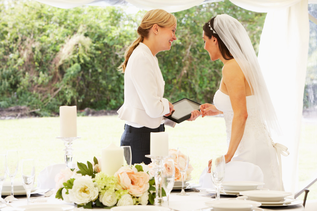 Bride standing with a wedding planner
