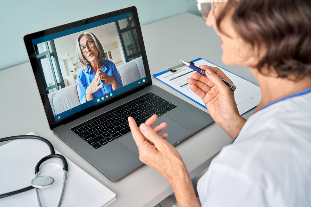 Woman consulting with a physician virtually